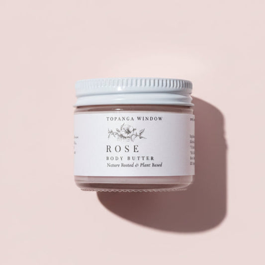 Jar of Topanga Window Rose Body Butter on a pink fabric background