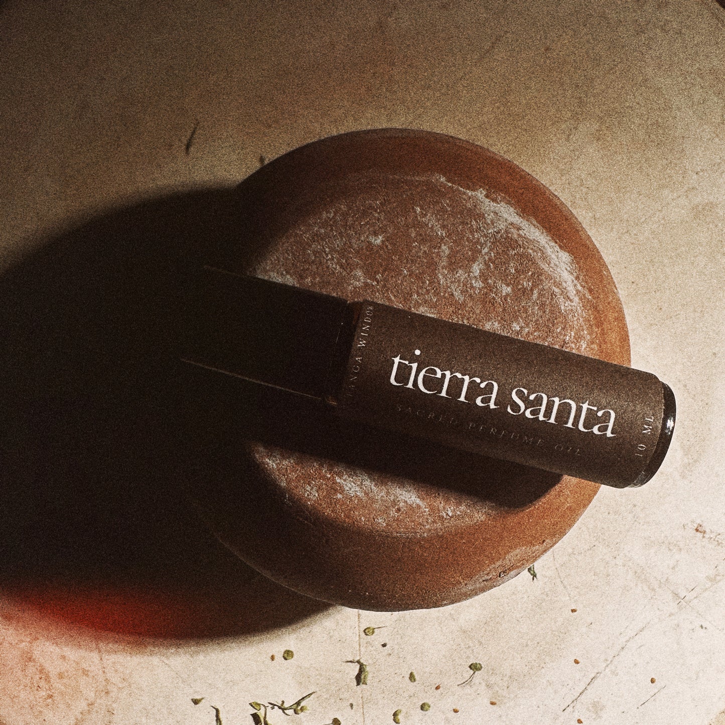 Tierra Santa perfume on a stone surface
