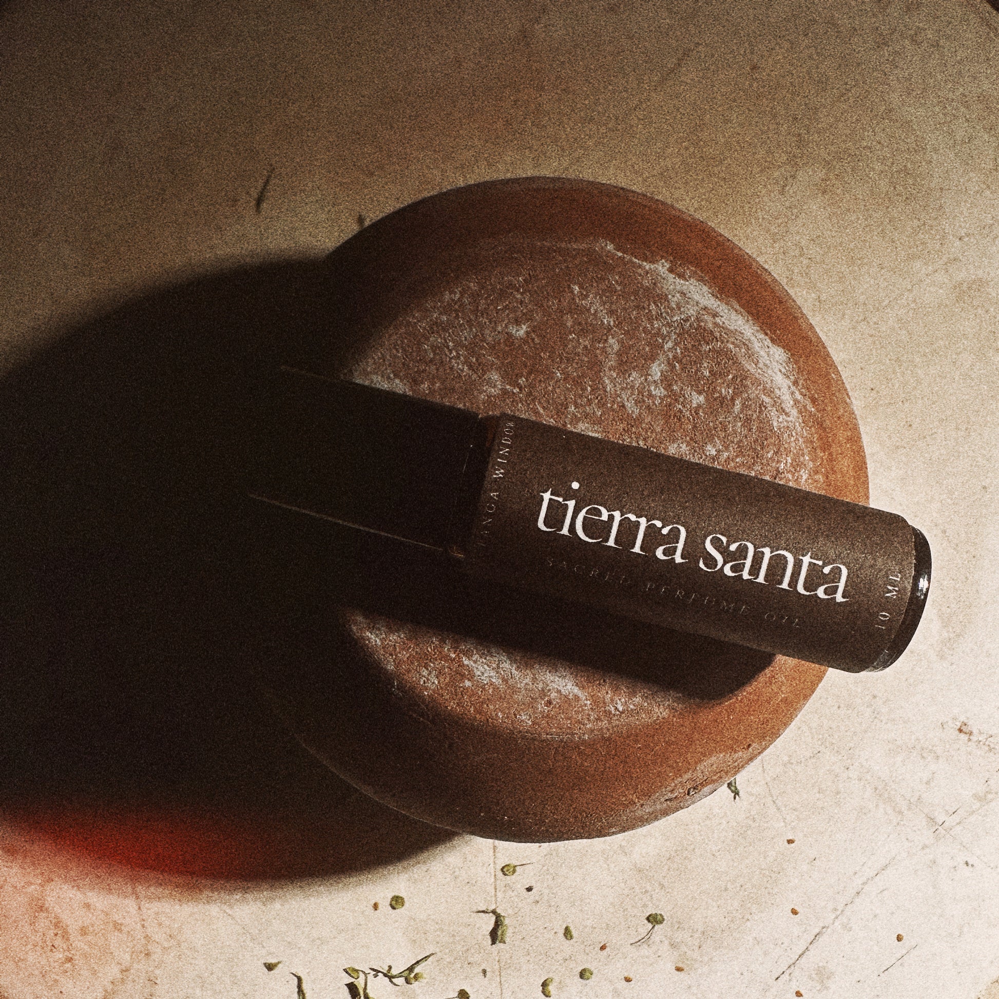 Tierra Santa perfume on a stone surface