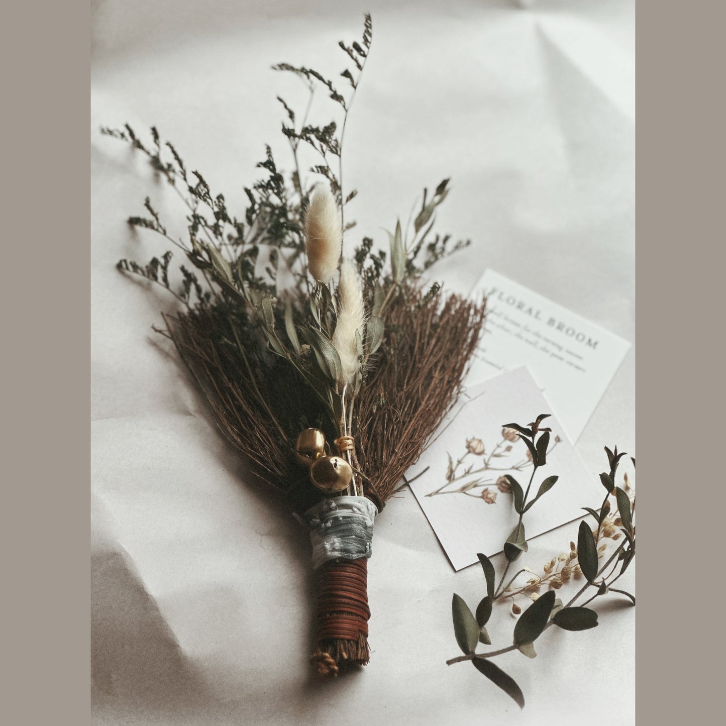 Winter Song mini botanical besom broom with dried botanicals, sari silk ribbon and gold jingle bells